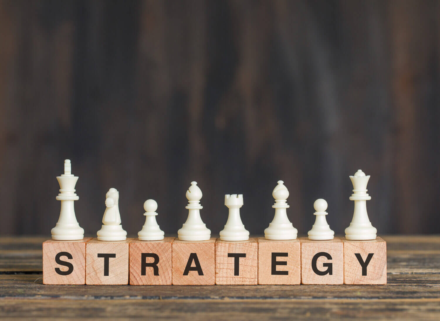 Business strategy concept spelt out with chess pieces