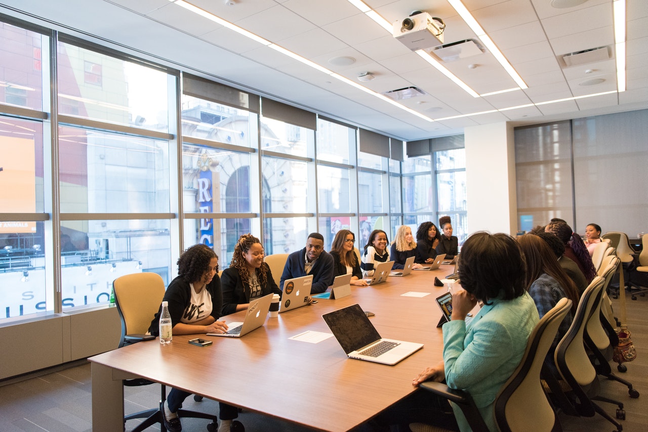 A board meeting of both men and women