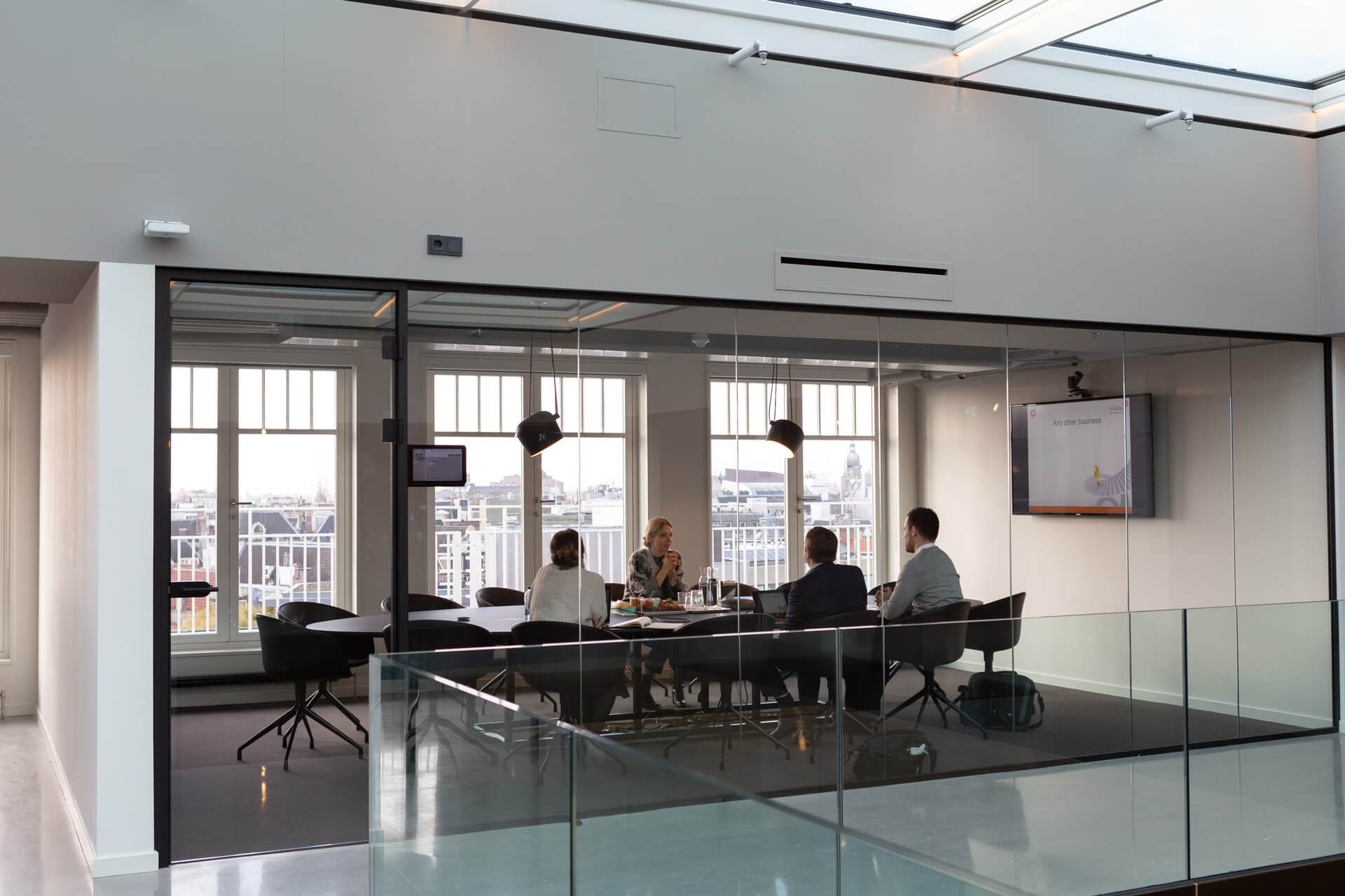 Group of businesspeople sitting in a conference room for a board meeting