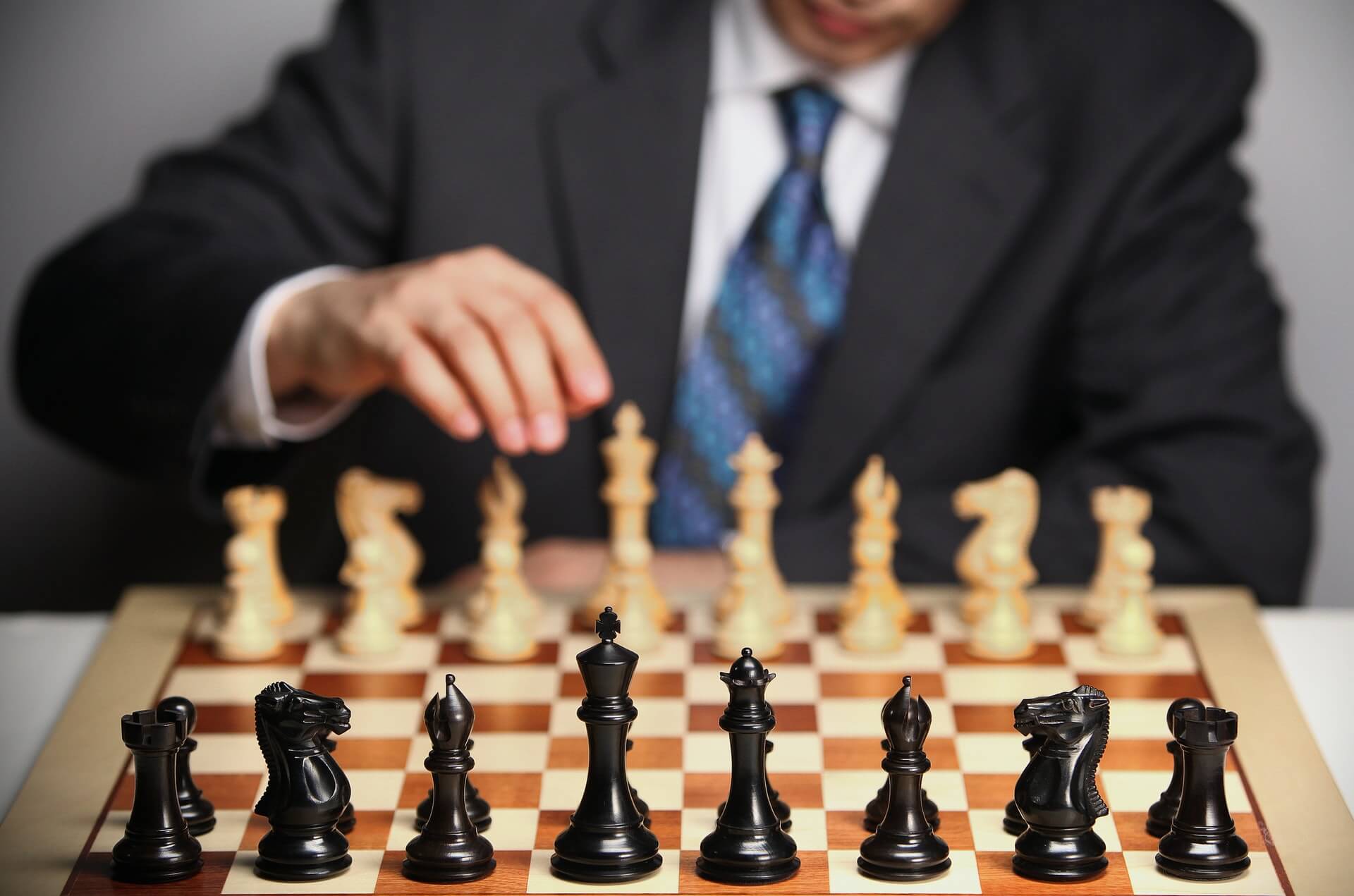 Man in suit playing chess