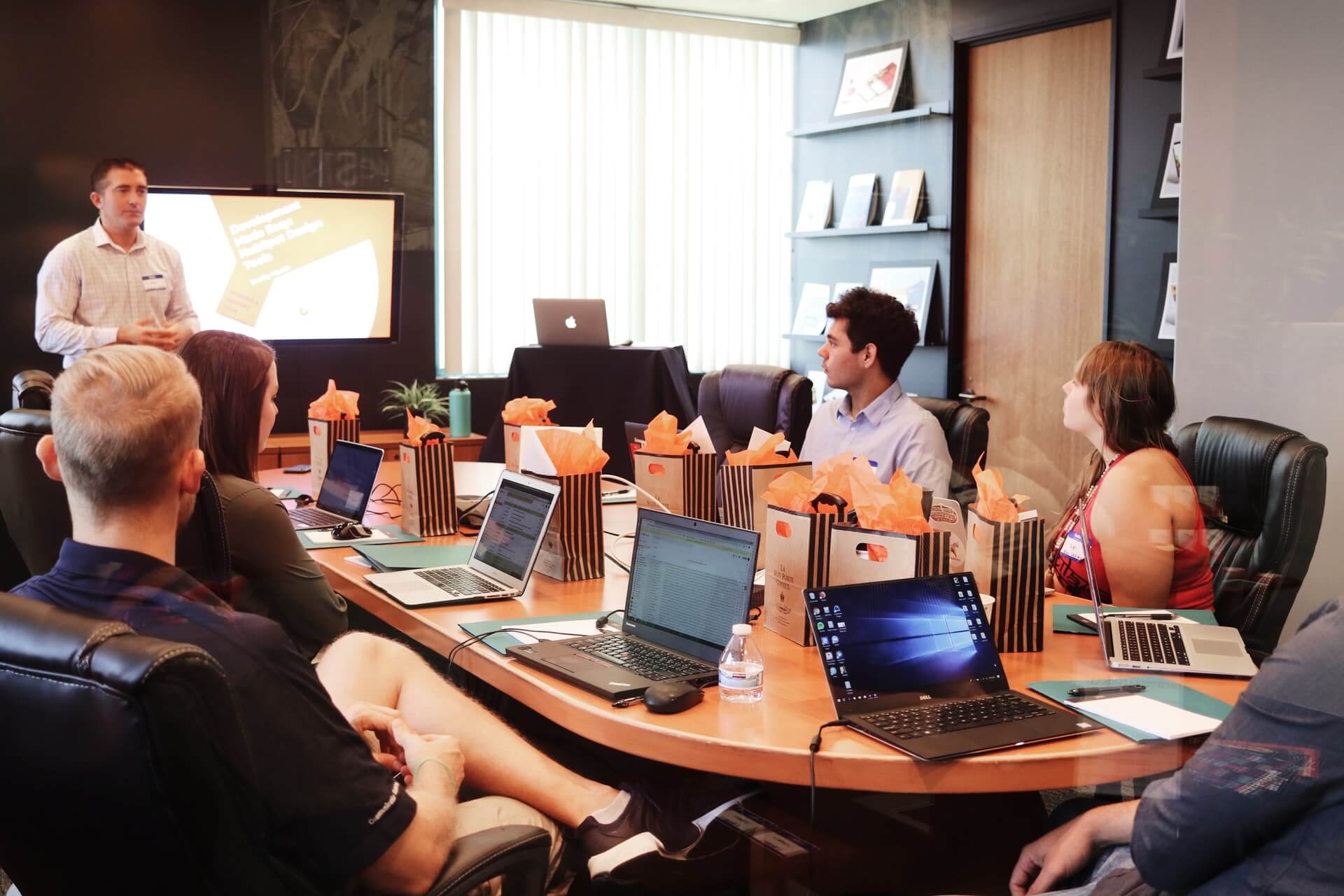 Business team in a meeting with a man presenting