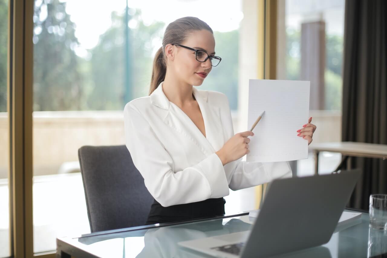 Businesswoman holding documents in an office