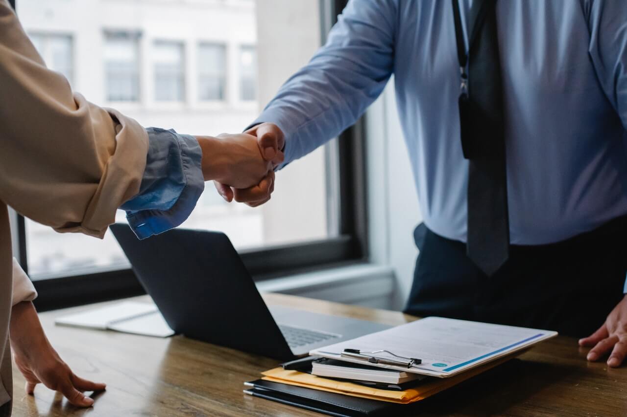 Businessmen shaking hands in an office