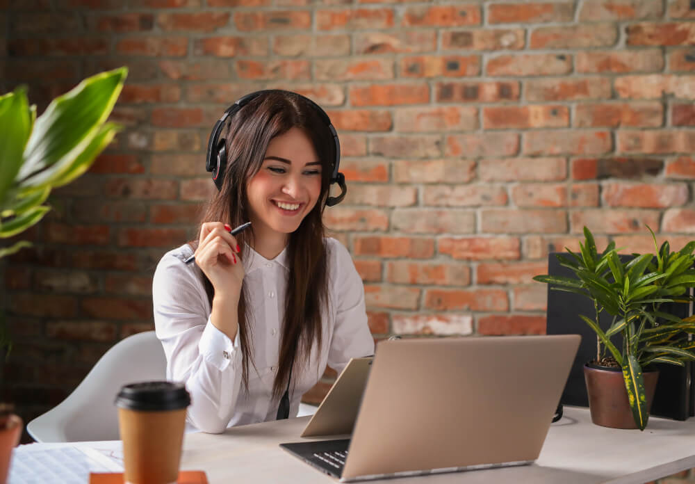 A smiling customer service worker on a call