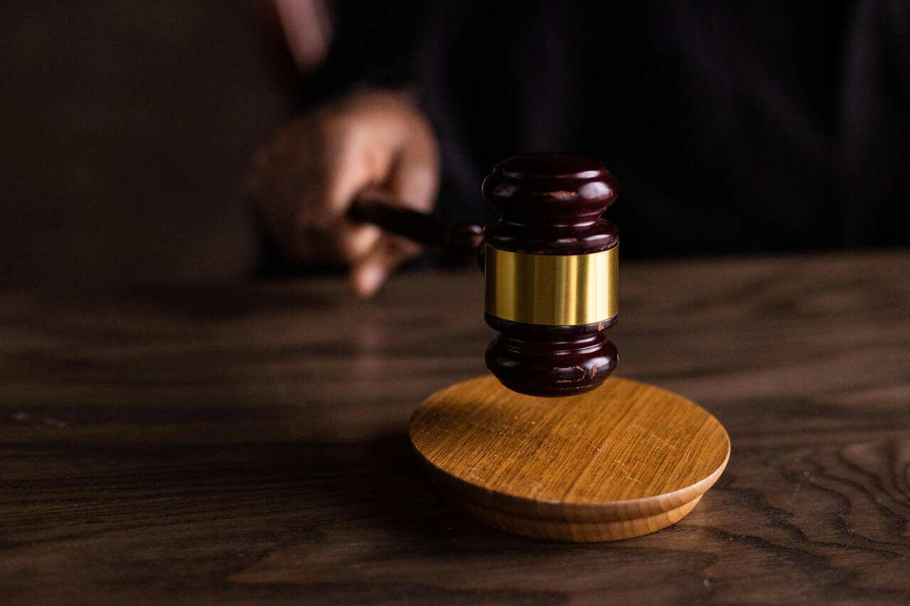 Brown wooden gavel on a desk