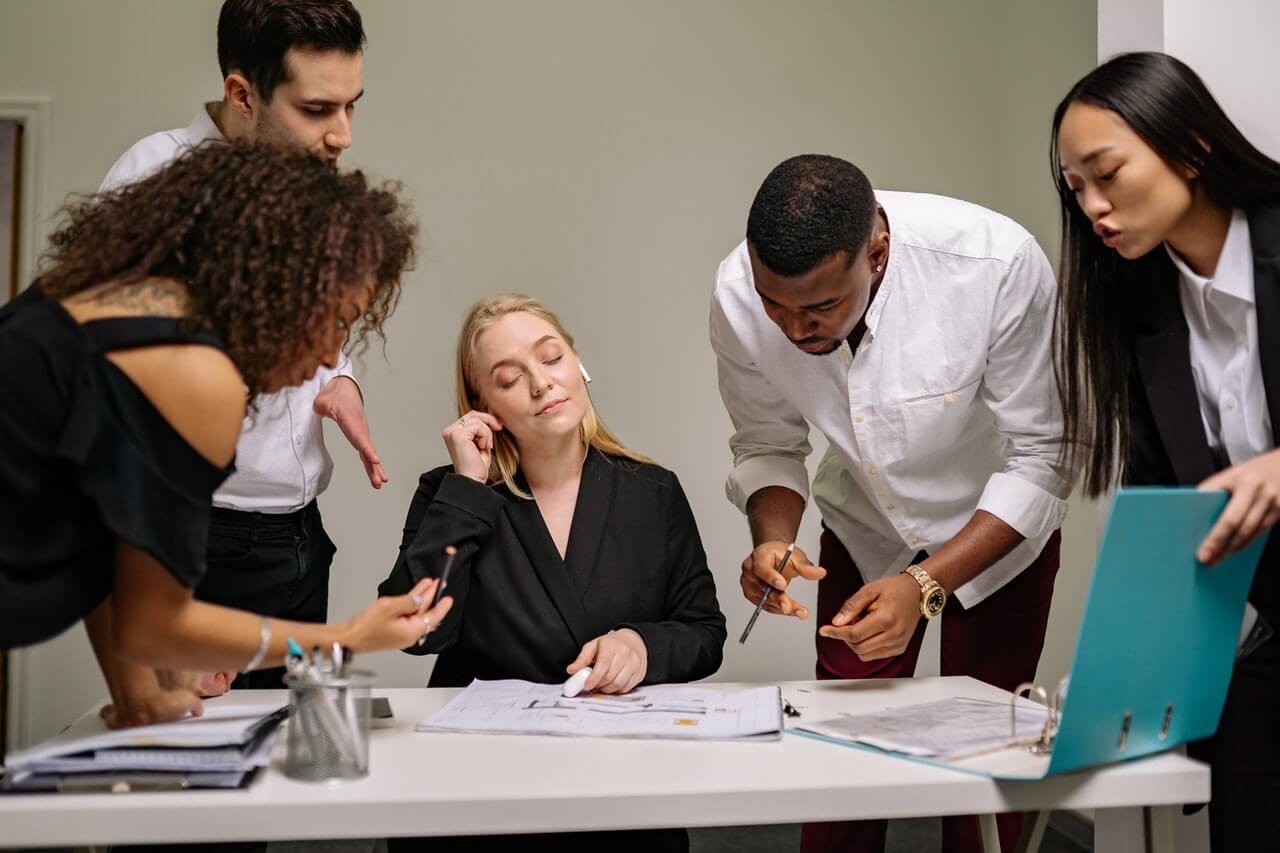 Businesspeople in a work meeting analysing their business' performance