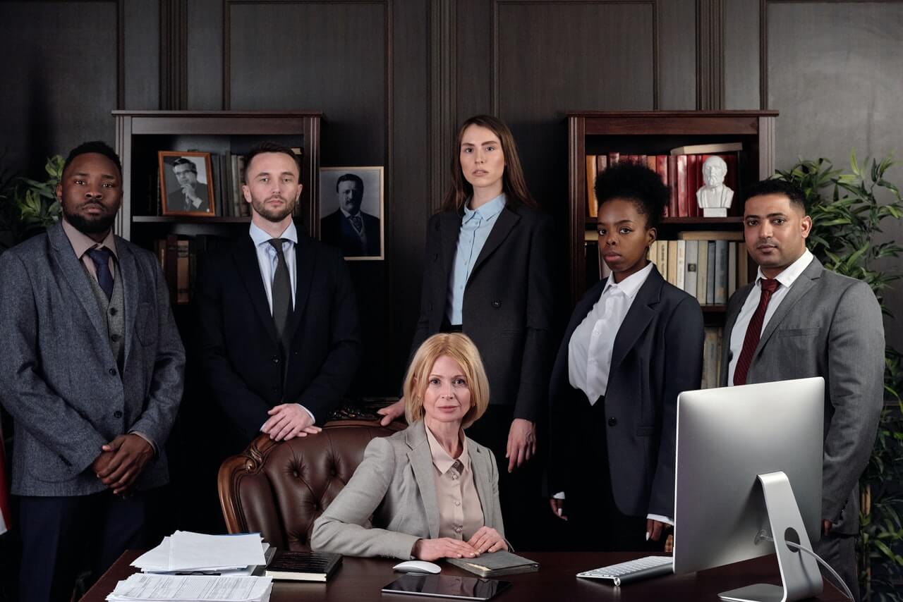 A legal team posing for a picture in the office