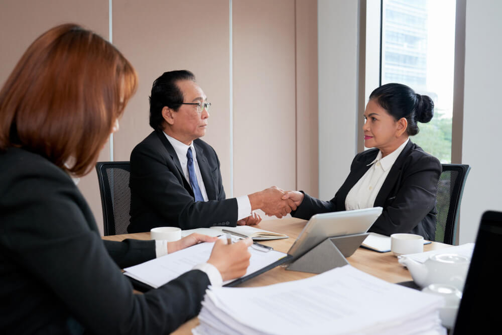 A secretary taking the minutes of a business meeting