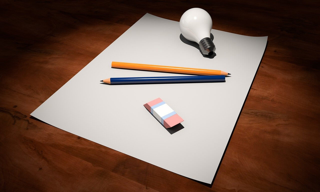 Sheet of paper and pens on a desk