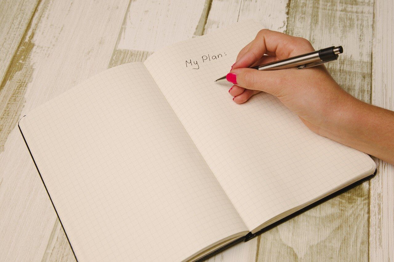 Hand planning a business using a notepad