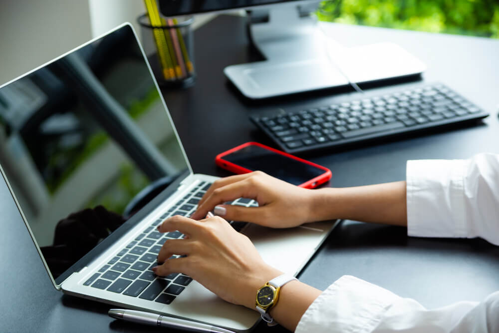 person working with is laptop