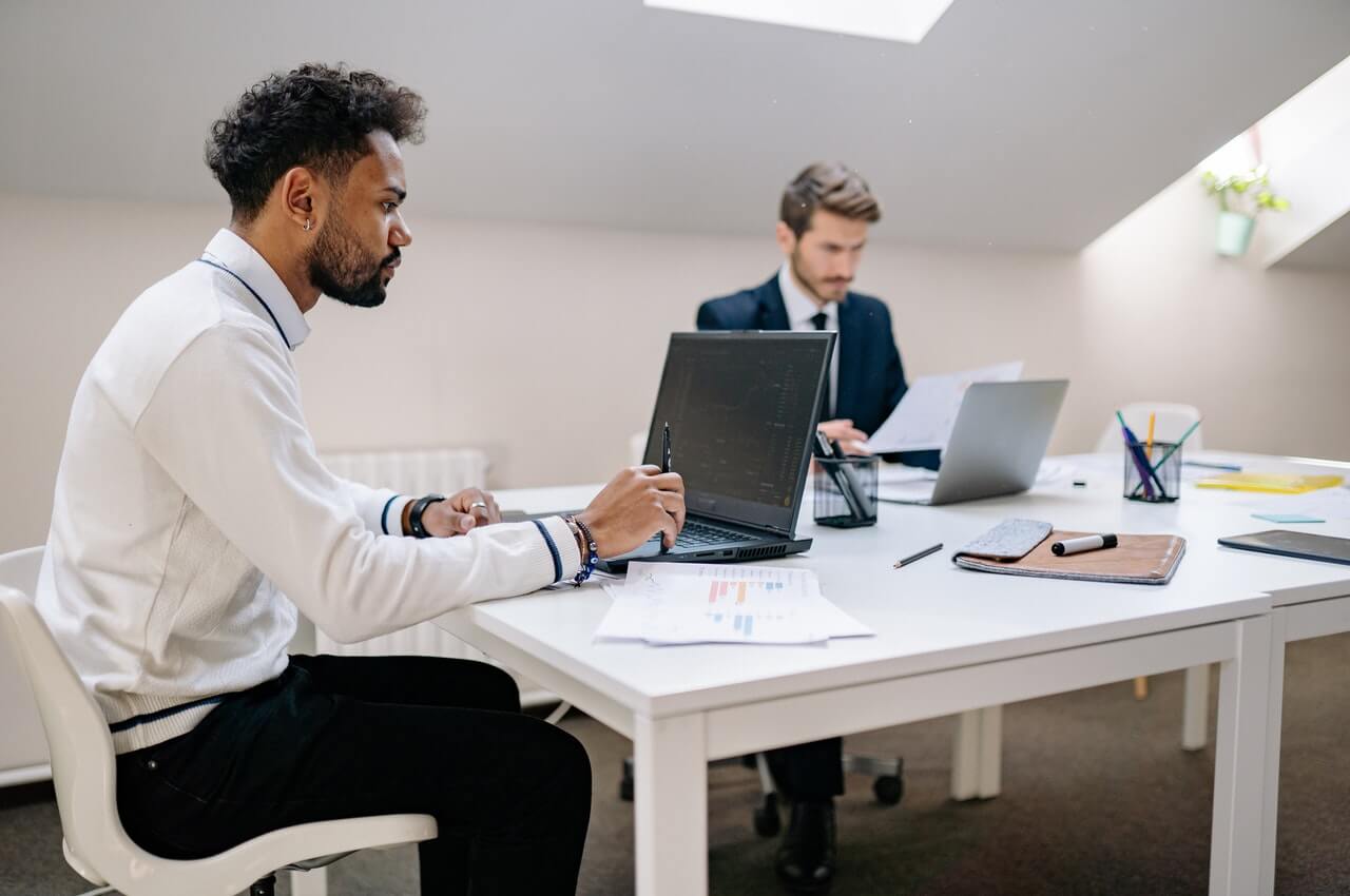 A-male-staff-going-trough-a-blog-on-his-laptop