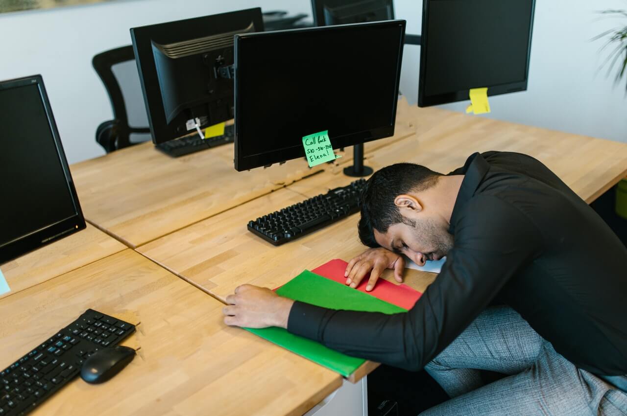 A-man-sleeping-in-his-office