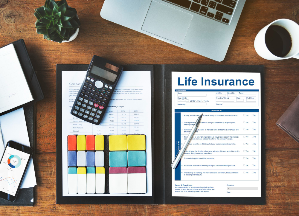 Best life insurance company's policy form on a desk with a calculator and pen