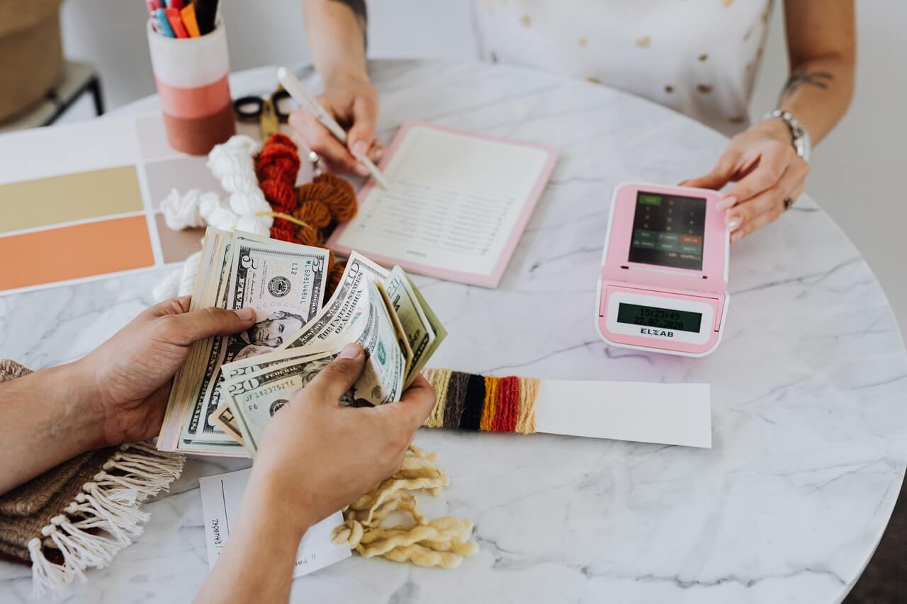 Business people counting their money