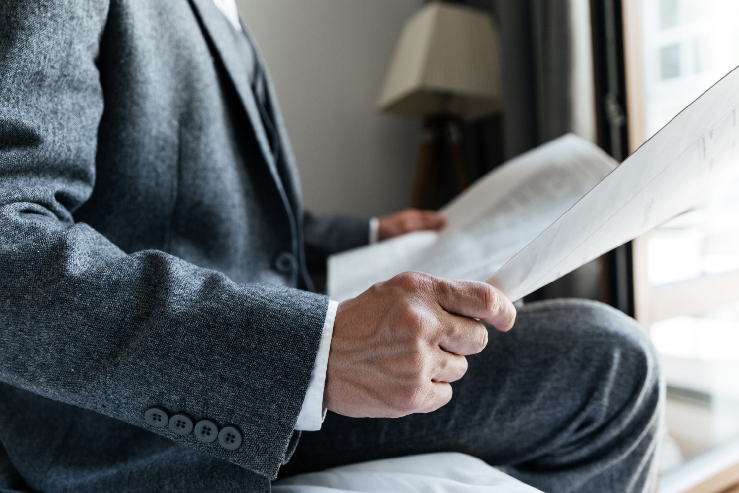 Cropped man reading a paper