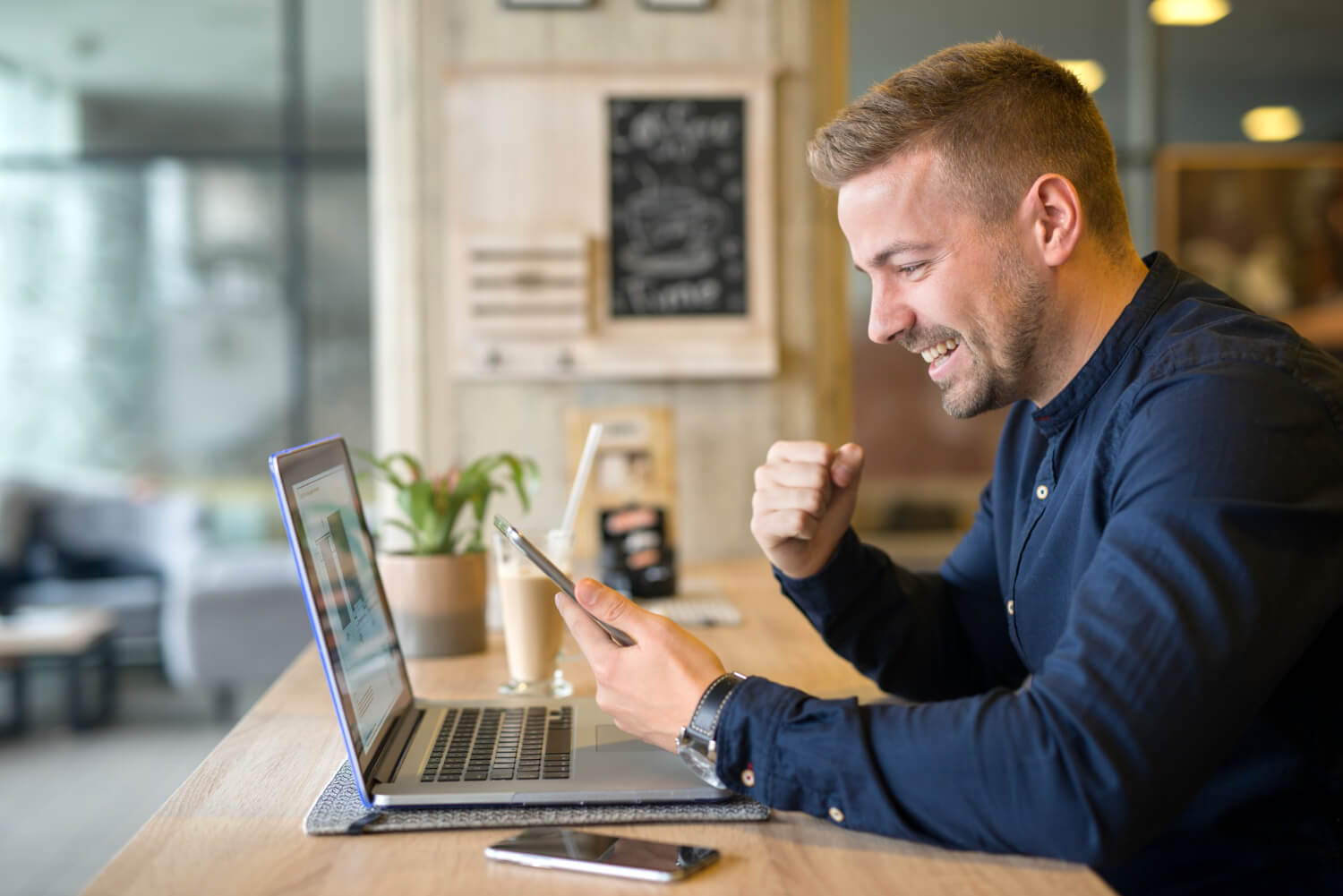 Man happy seeing his business improving online