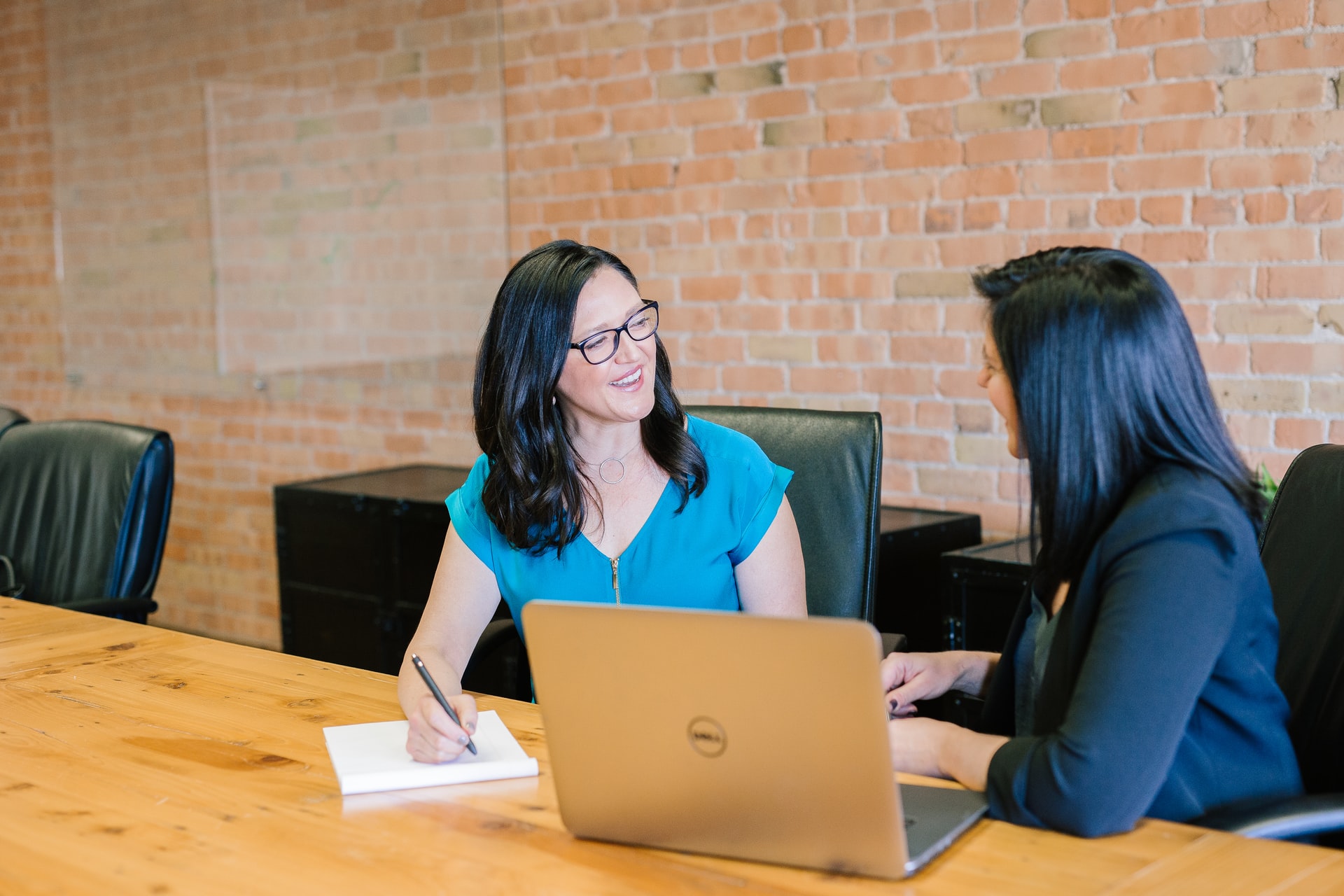 Two ladies having a discussion in a meeting