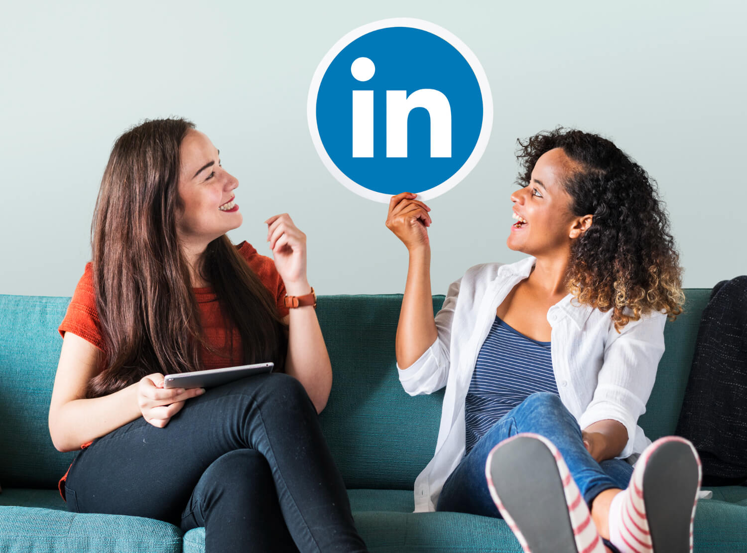 Women holding a LinkedIn signage