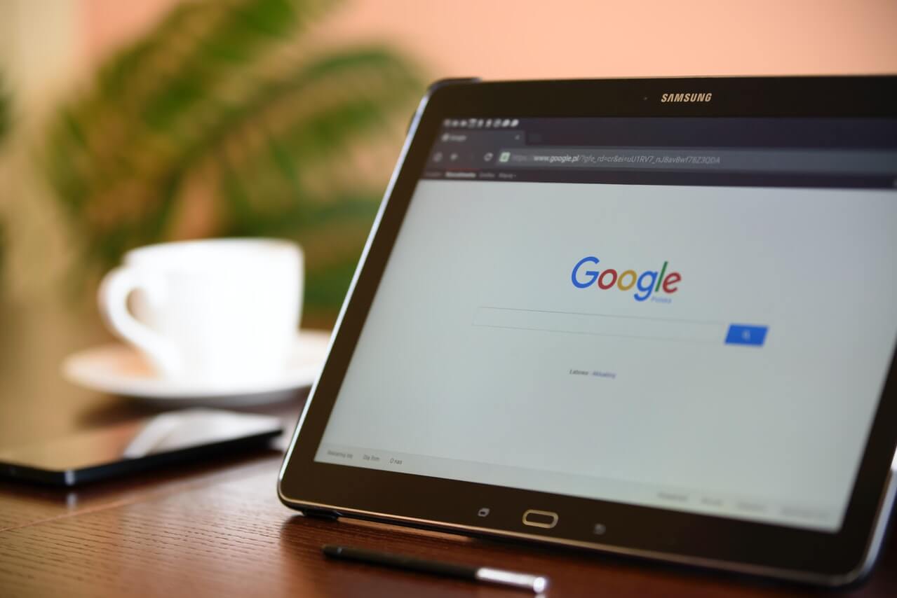 Black tablet on google page on a desk