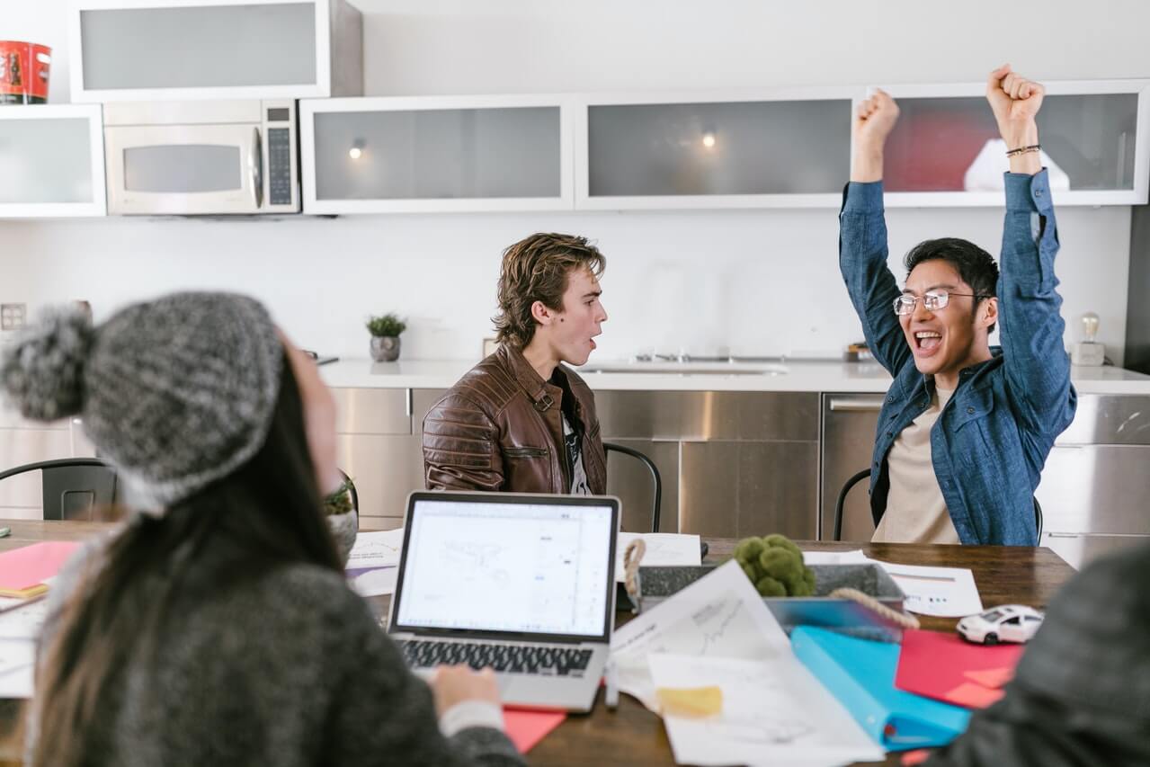 Colleagues communicating happily