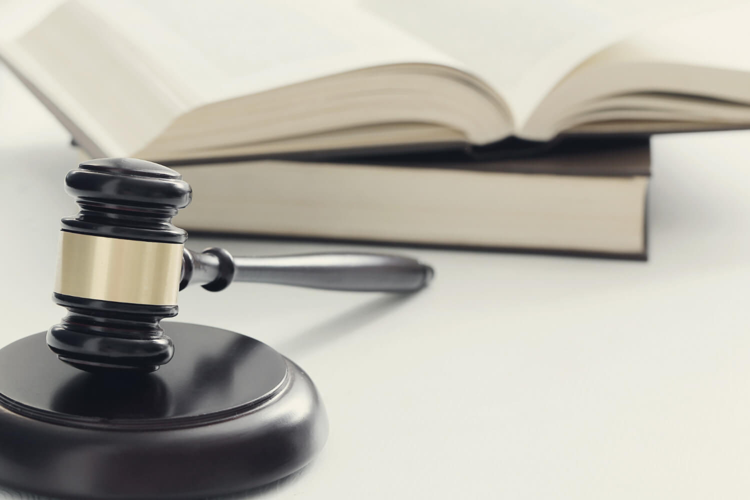 Court hammer and books on a desk