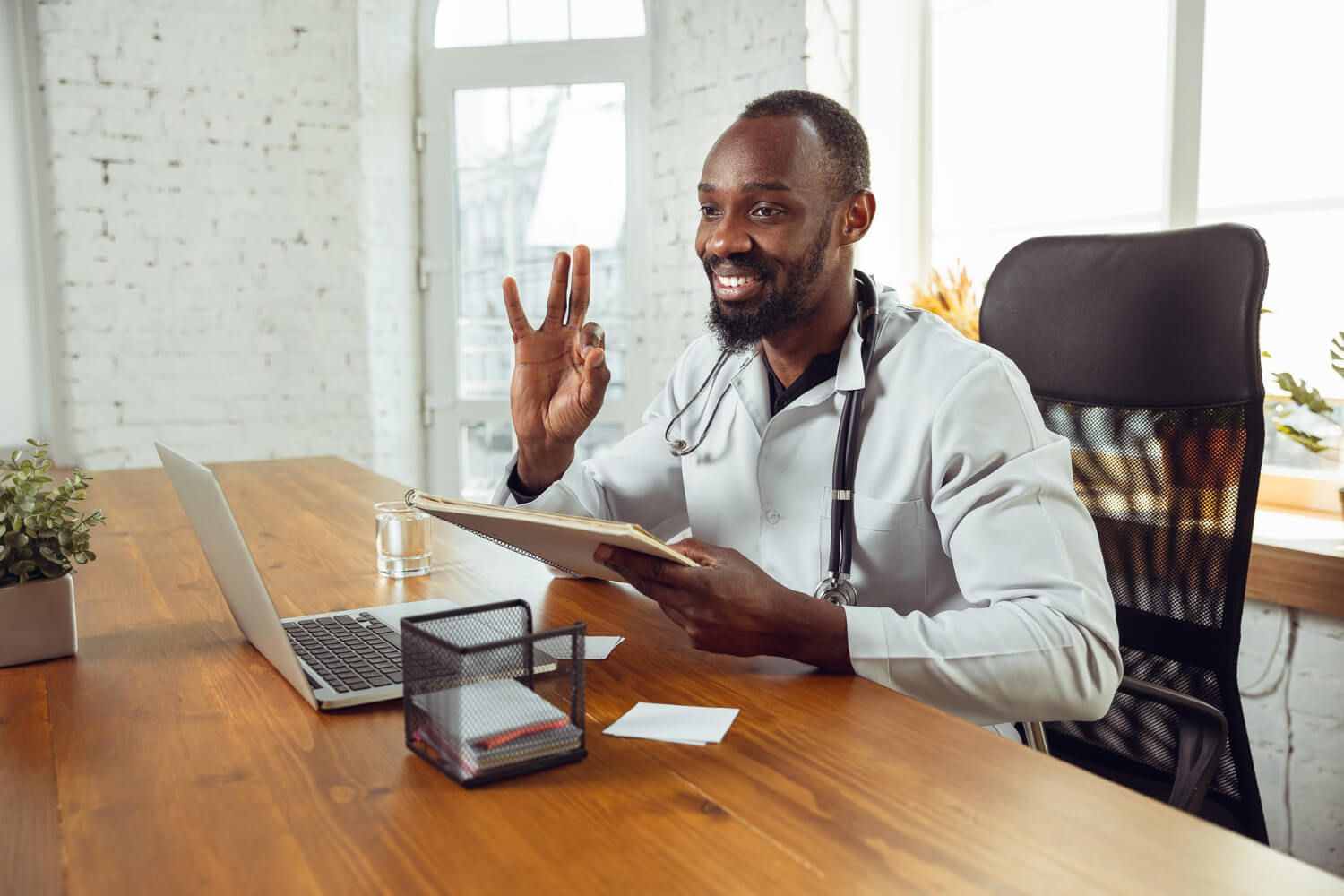 Doctor consulting a patient with an okay gesture