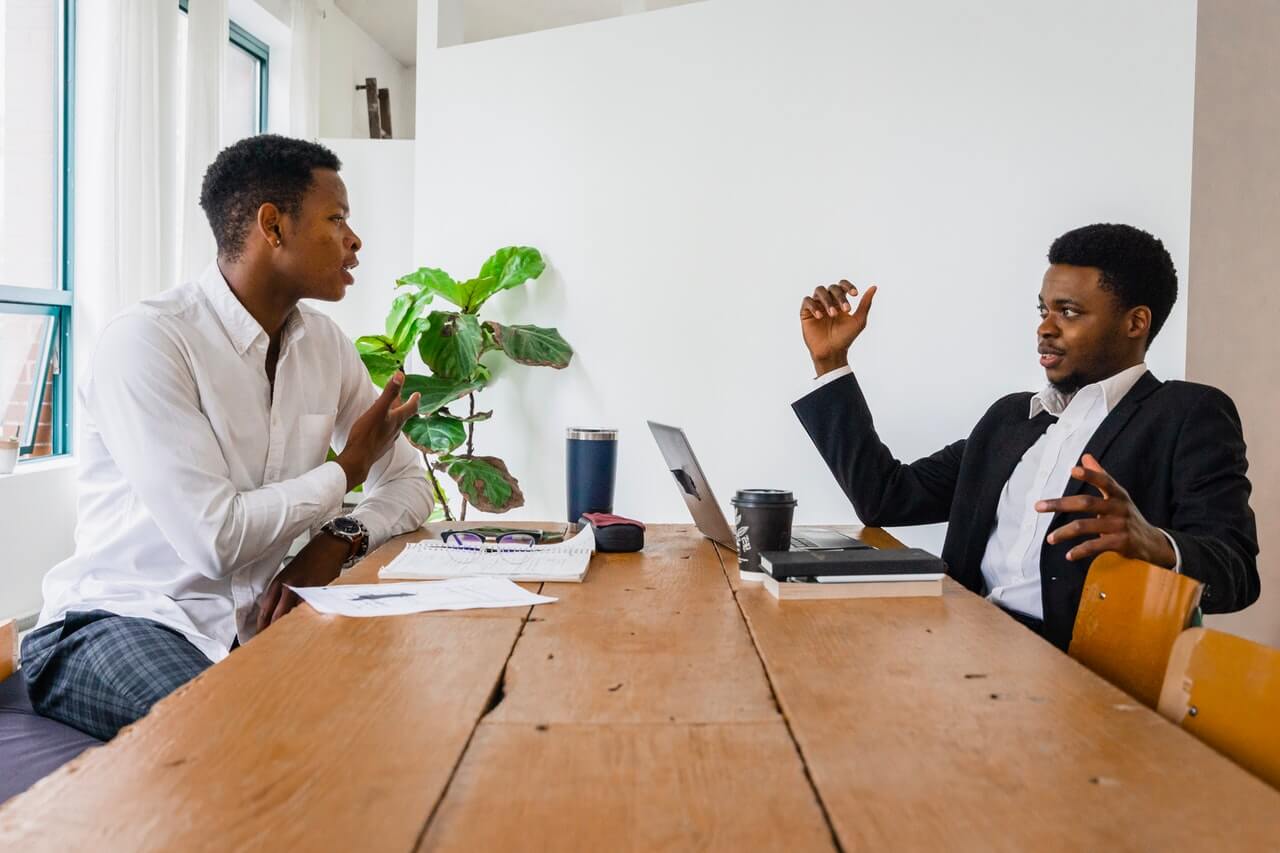 Two Men Talking to Each Other About Business