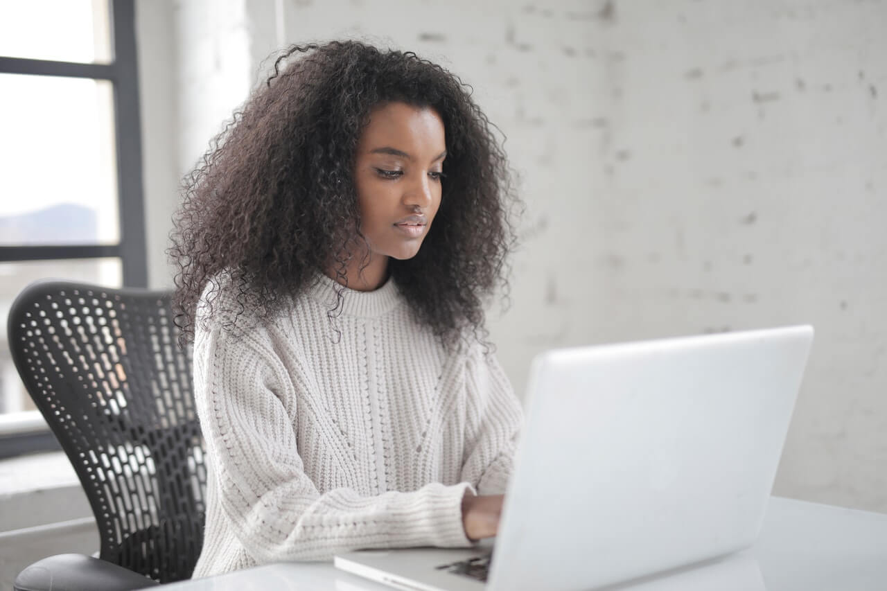 Young focus lady using a laptop