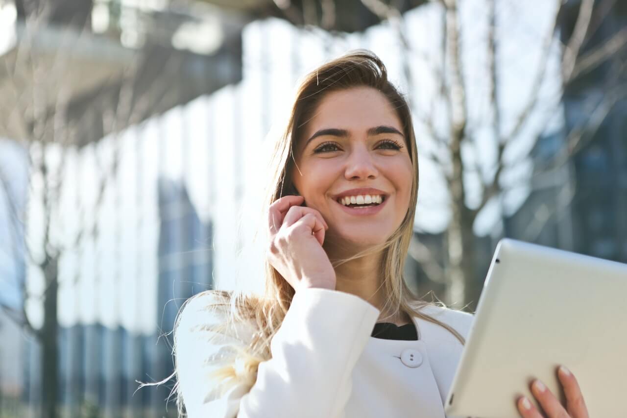 Young lady smiling while on a phone call