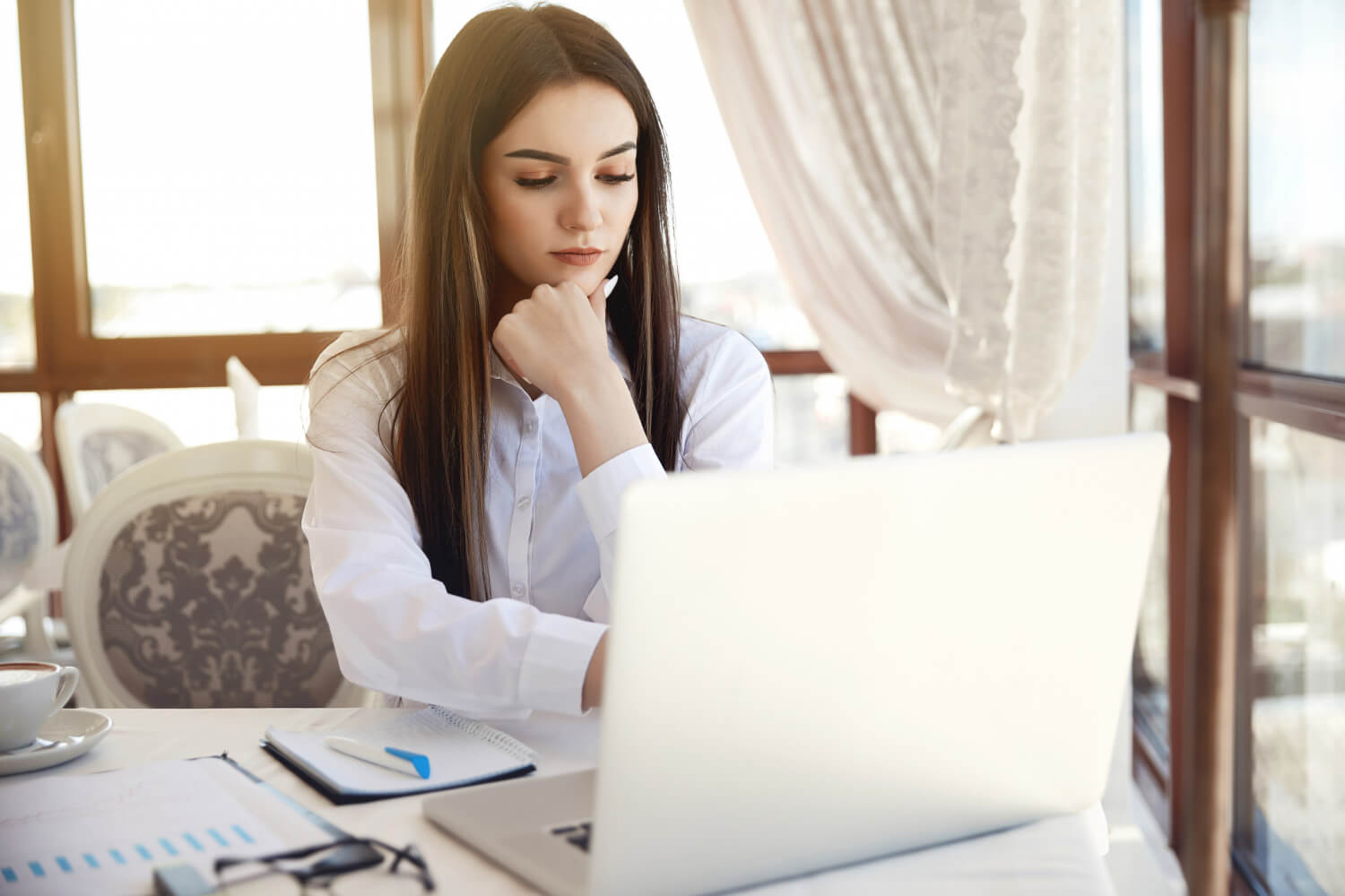 Young woman looking at a laptop