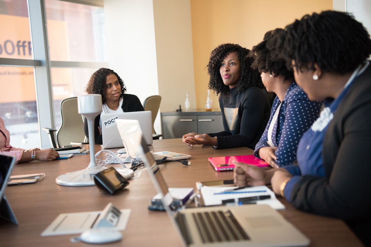 Group of workers discussing in a meeting