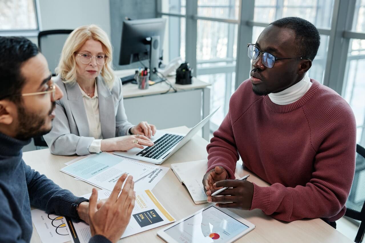 A Group of People Having a Discussion in the Office