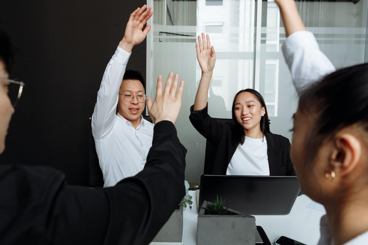 A Group of People Having a Meeting in the Office