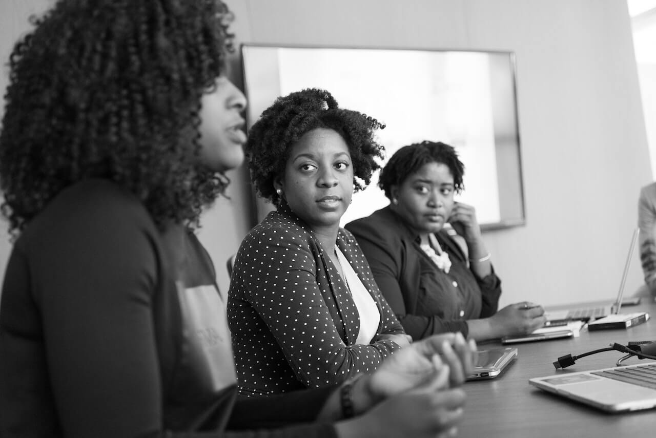 Business women in a meeting discussing crisis and challenges