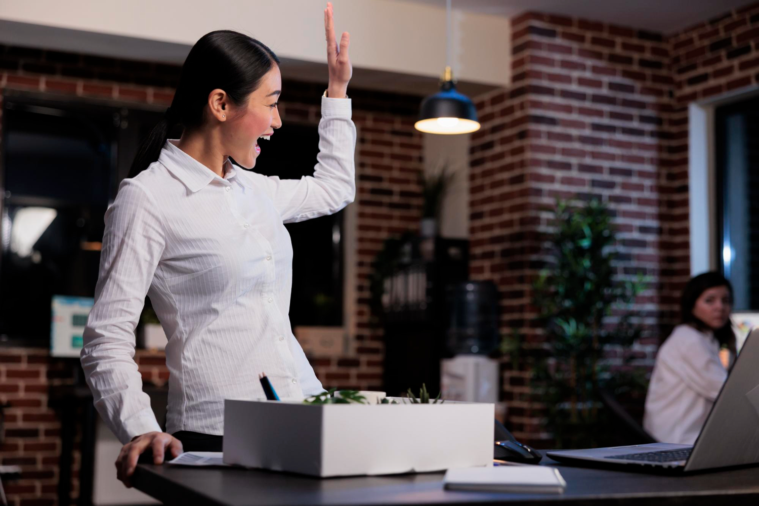 A-businesswoman-unpacking-her-belongings-after-being-called-back-to-work.