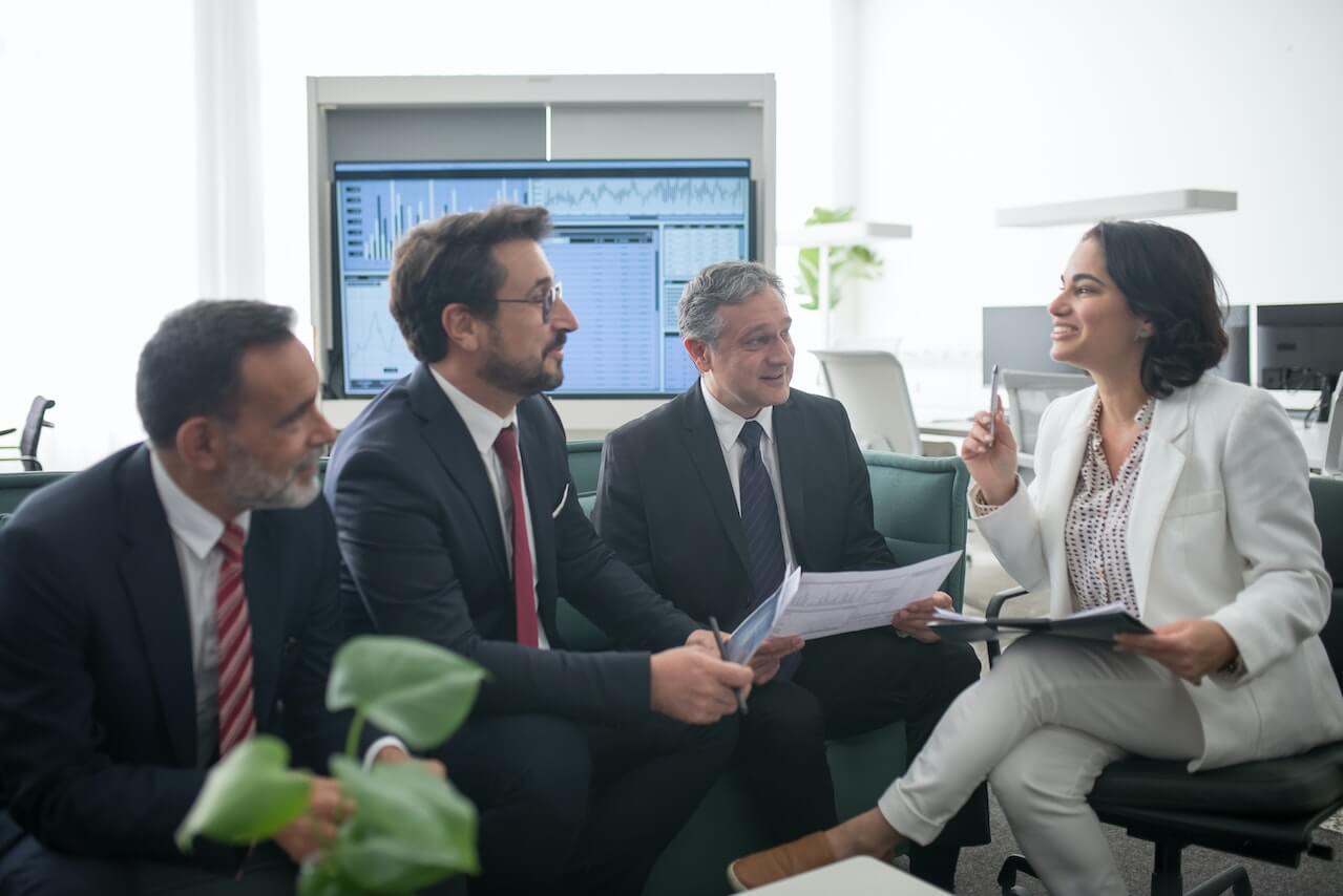 a female manager convincing potential investors on the benefits of her company