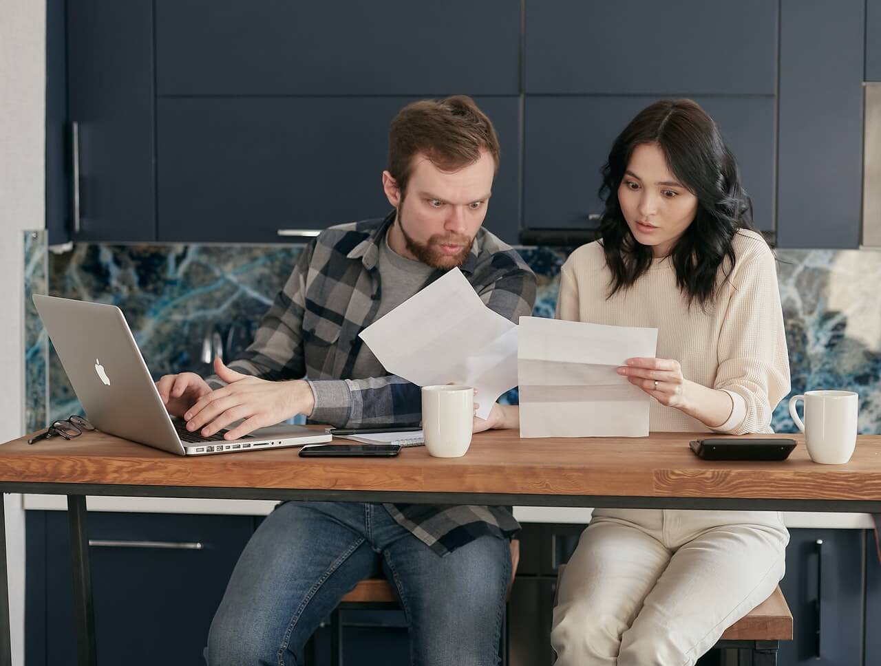 A-man-and-a-female-colleague-working-together-on-an-assignment