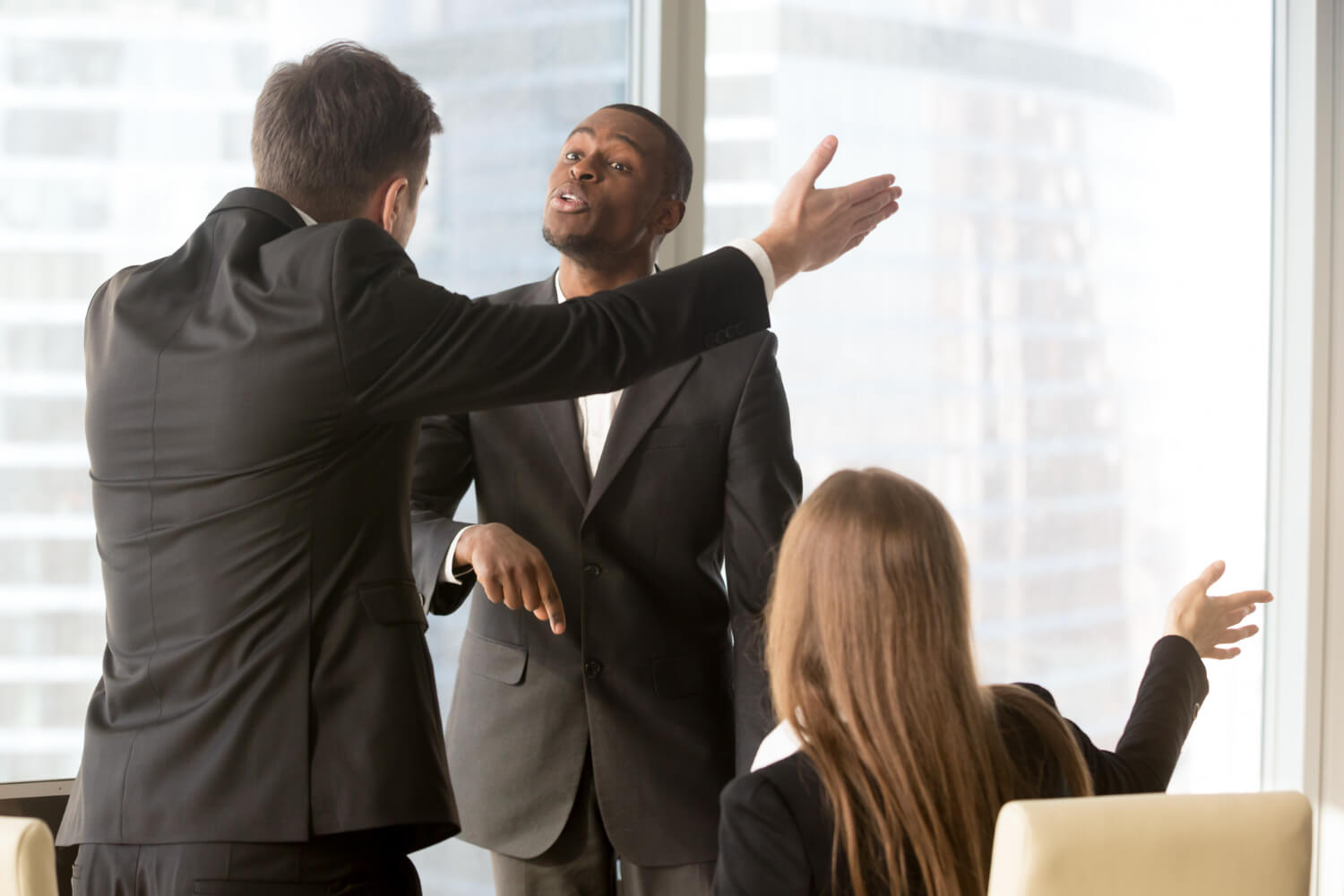 Annoyed-business-partners-arguing-during-meeting