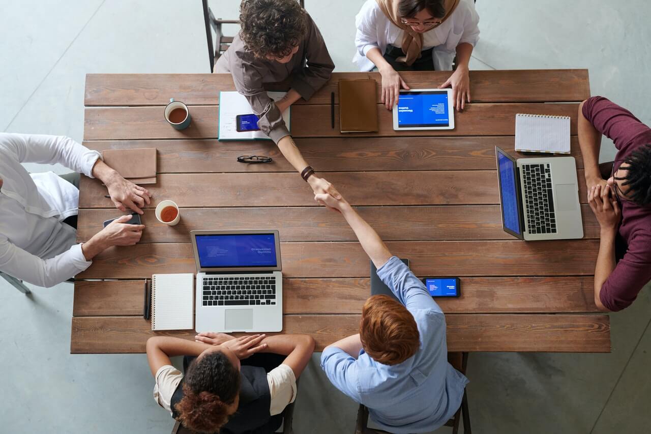 Group of Persons Sitting in an office space