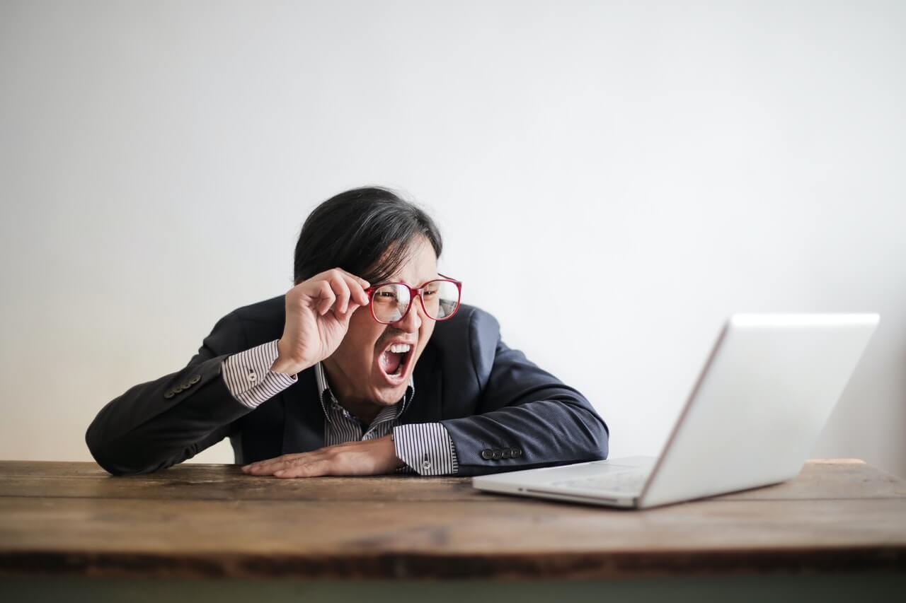 Businessman struggling with work crisis