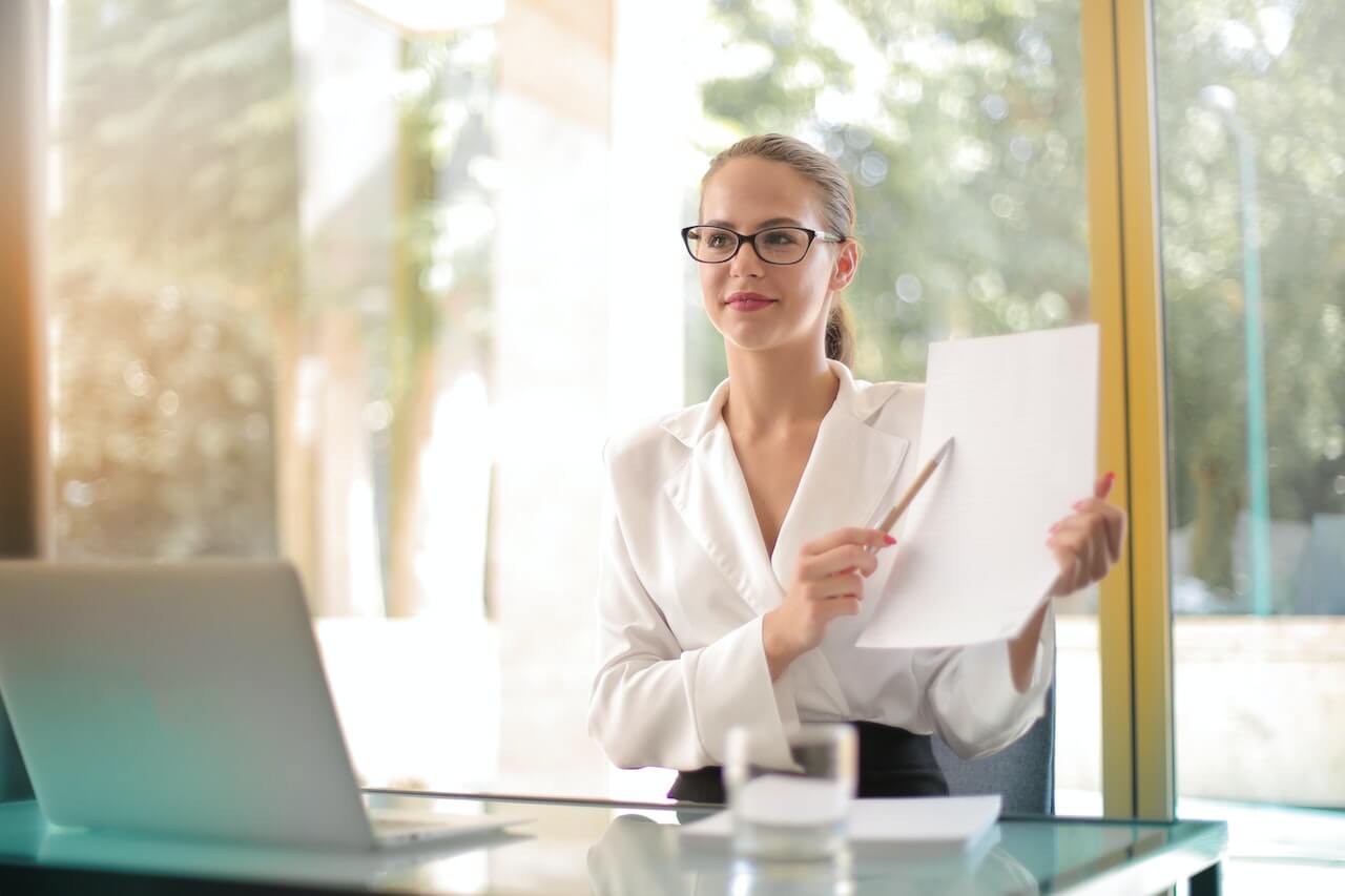 A young businesswoman holding a paper file