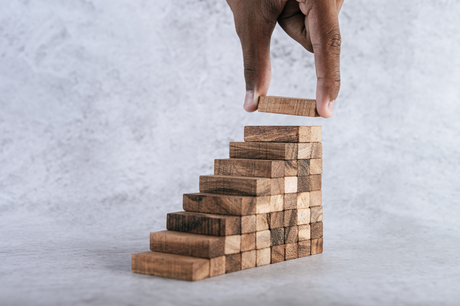 Stacking wooden blocks step by step