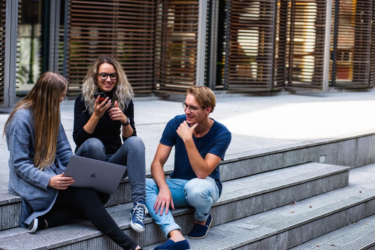 Three-persons-talking-to-each-other about their plans for spring