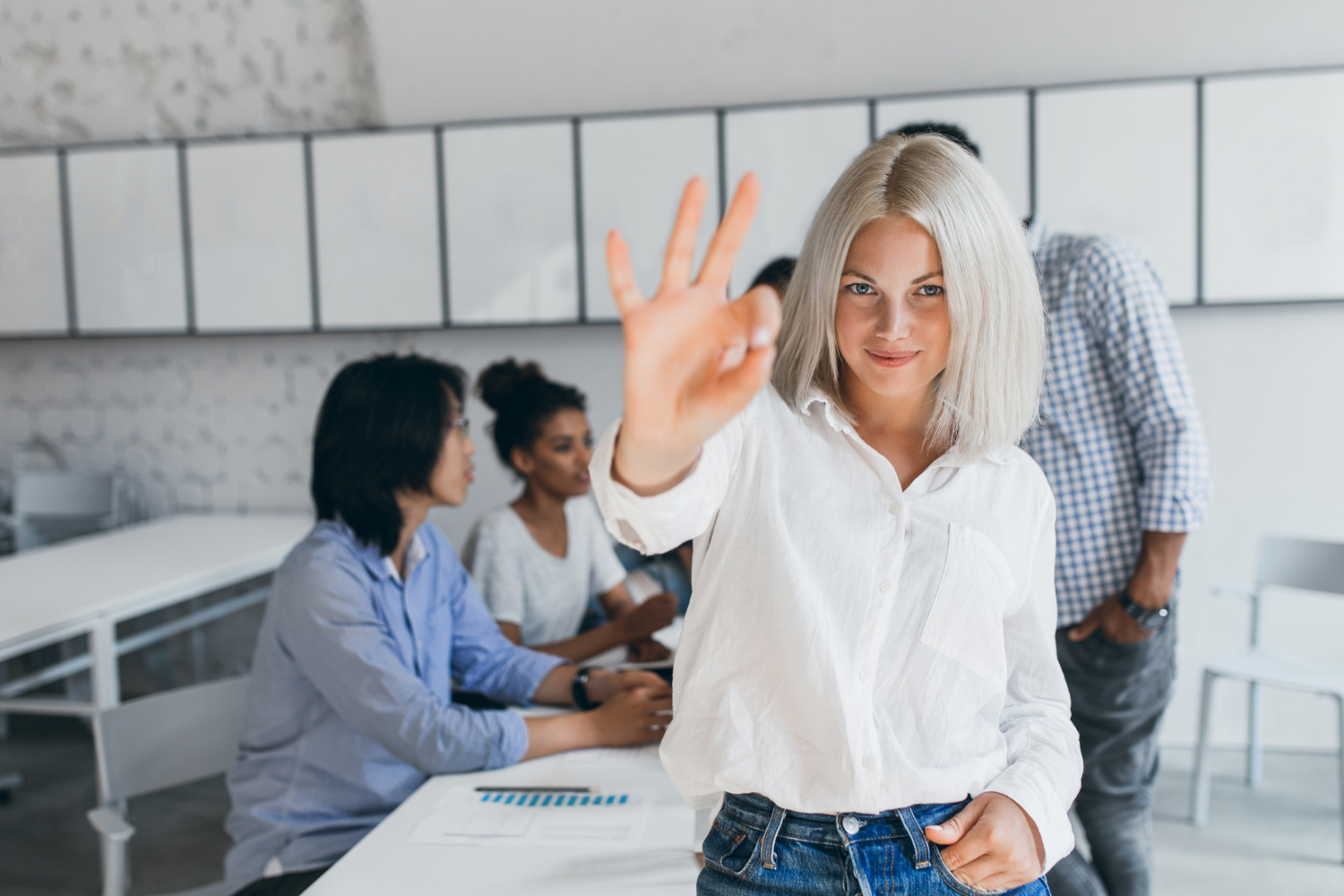 A successful ''office manager standing in front a camera