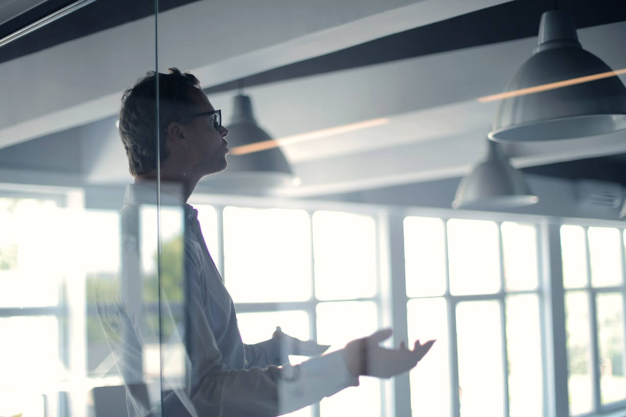 Male employee gesticulating in an office space