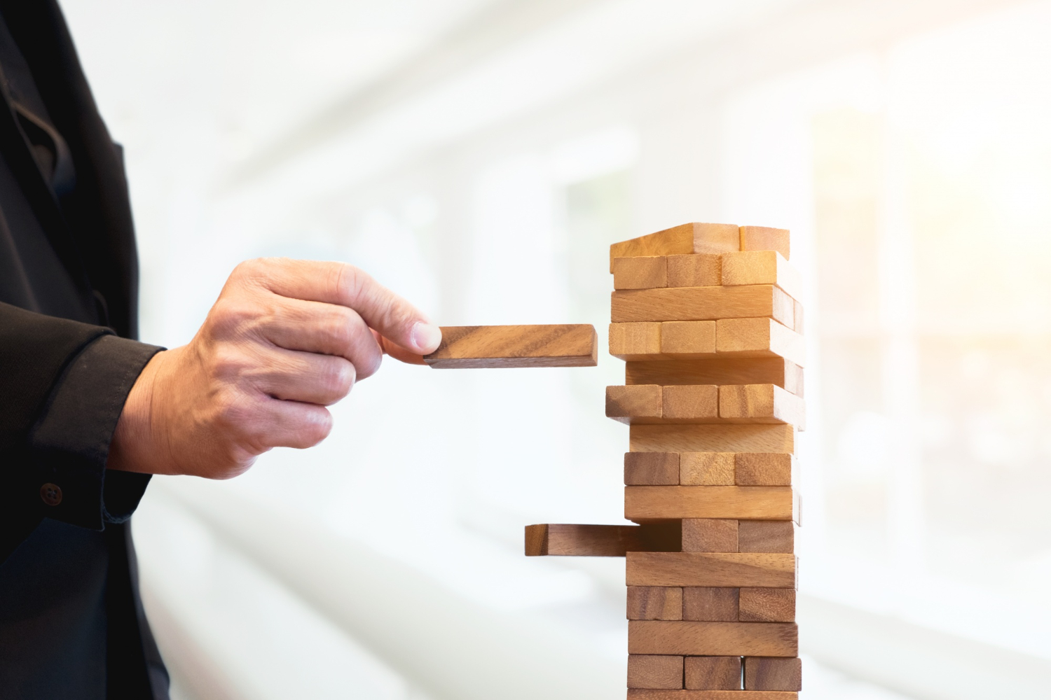 Lady stacking wooden blocks