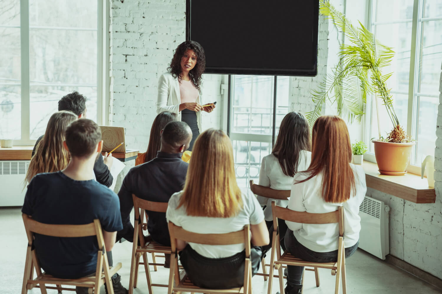 Young female speaker having a training section