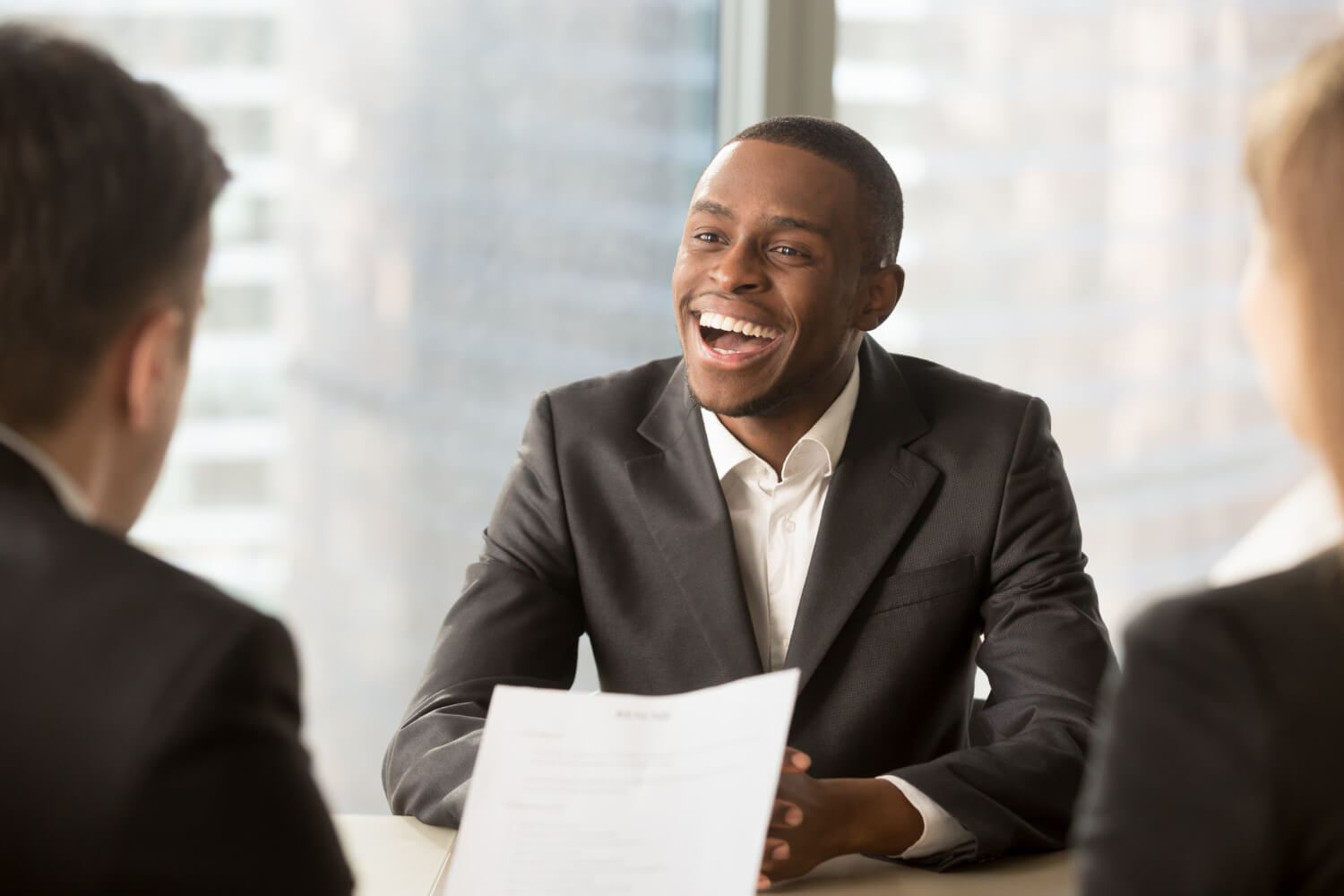 happy-black-male-candidate-getting-hired-got-job