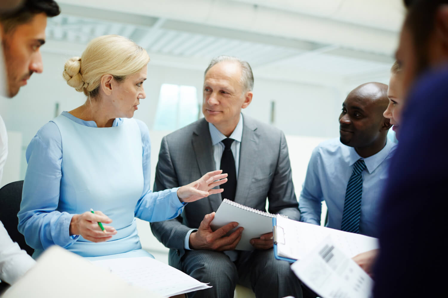 A group of managers talking business in an office